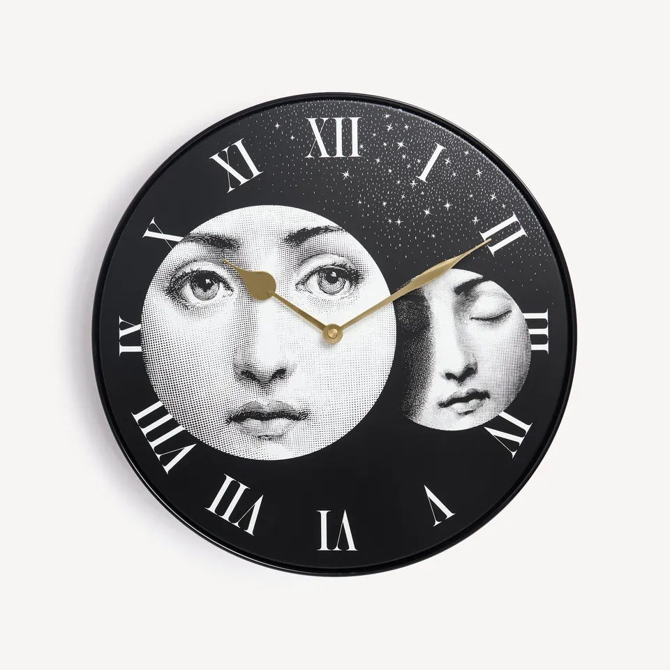 fornasetti-eclissi-wanduhr-metall-lautlos-lina-cavalieri image 1